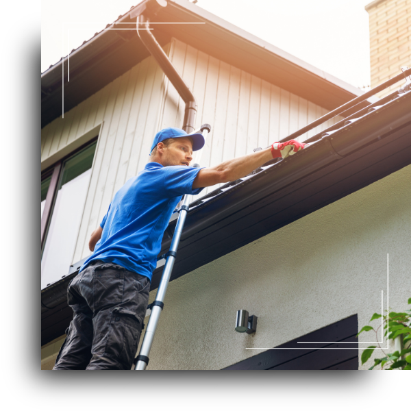 A roofing contrator installing gutter guards on a home.