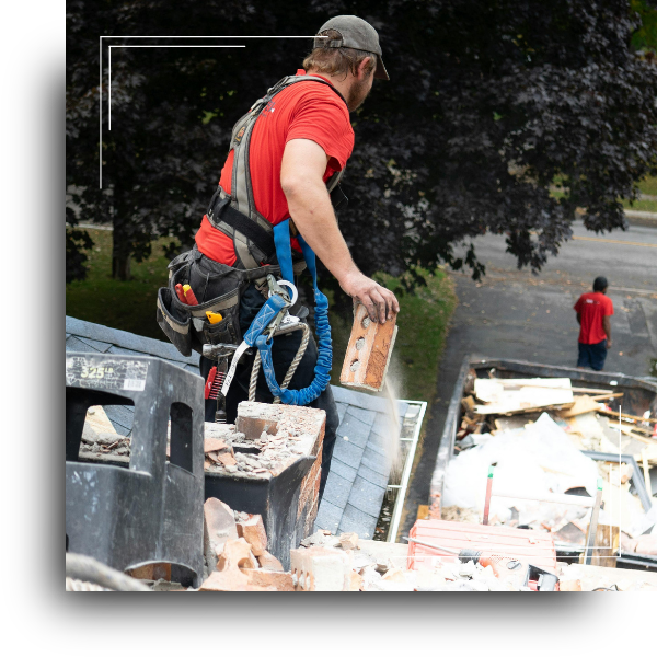 Roofing professional replacing a residential roof.