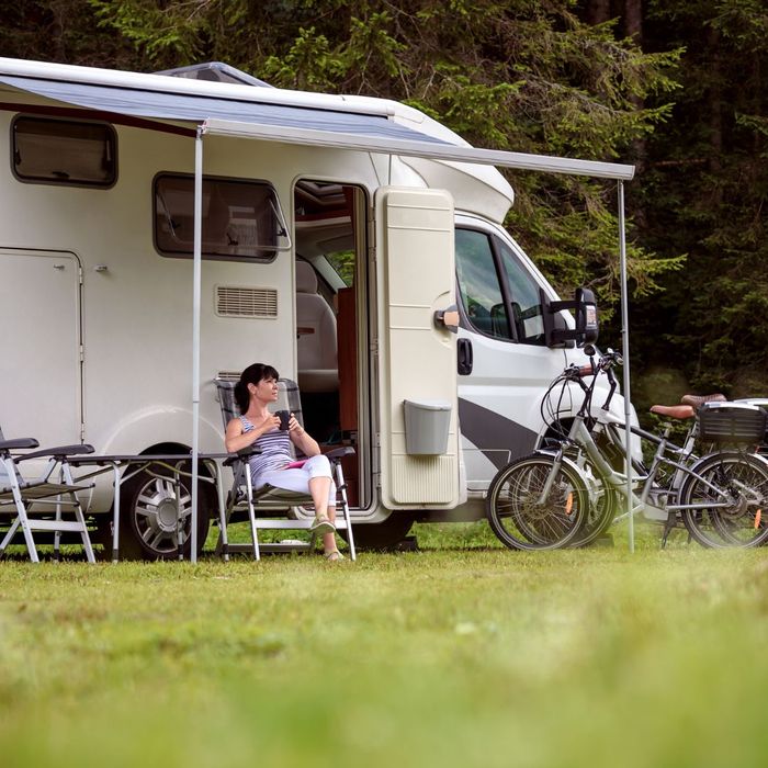 woman sitting outside motorhome woman sitting outside motorhome