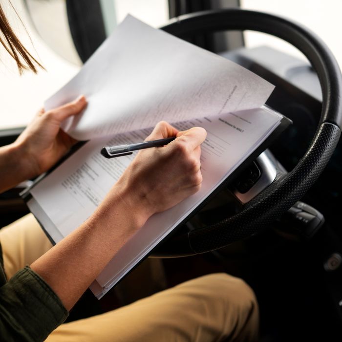 image of someone filling out paperwork