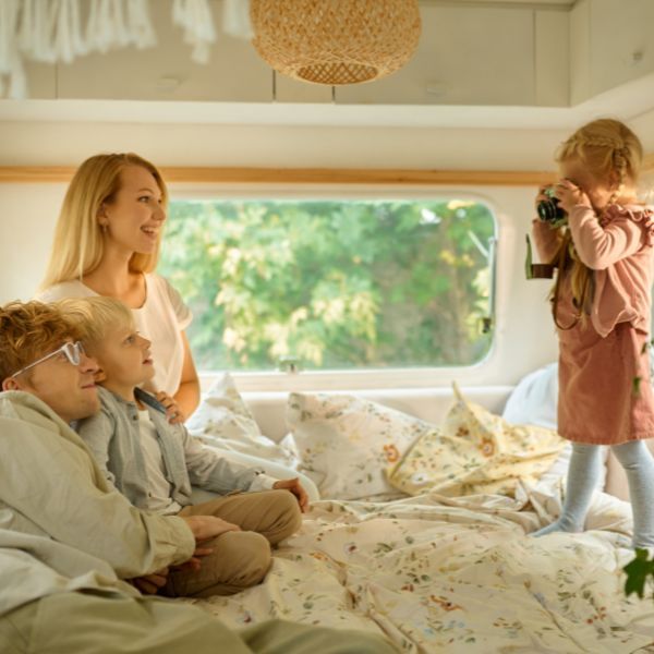 Family sitting in a motorhome. 