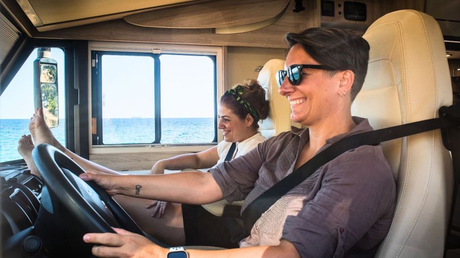 Couple laughing while in a RV