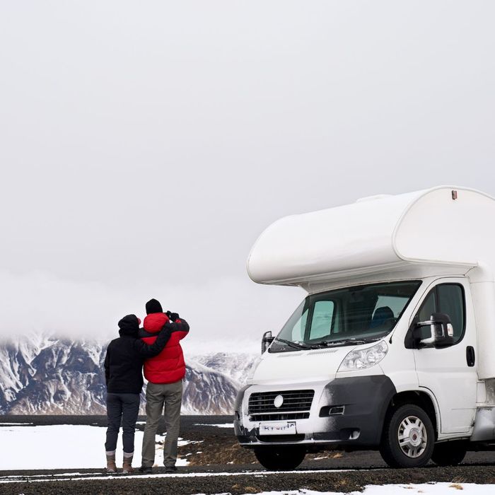 couple standing outside of motorhome couple standing outside of motorhome