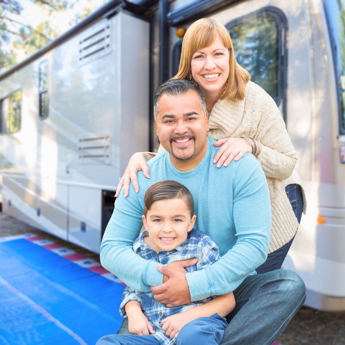 Happy family outside of an RV