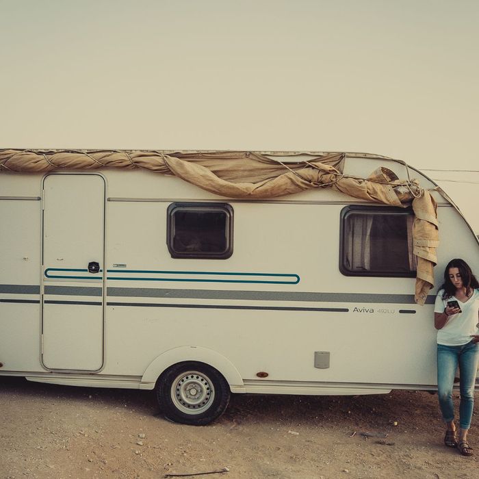 Standing in front of a Camper