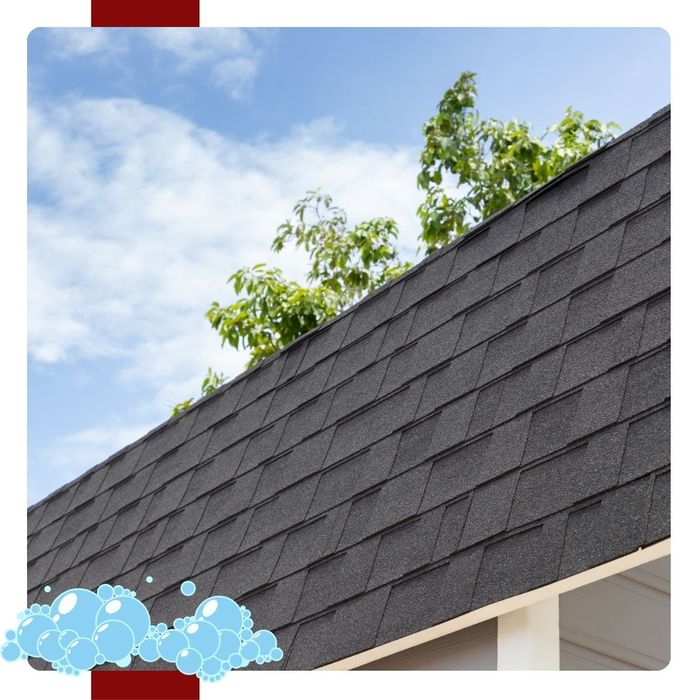 The side of a nice asphalt roof with a blue sky in the background