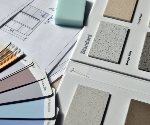 Material samples and blueprints for commercial remodeling design