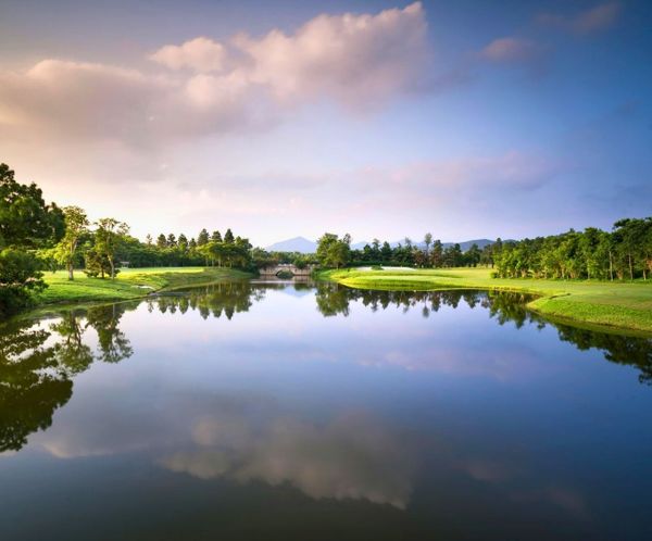 Scenic lake view with golf course reflecting environmental engineering and land development