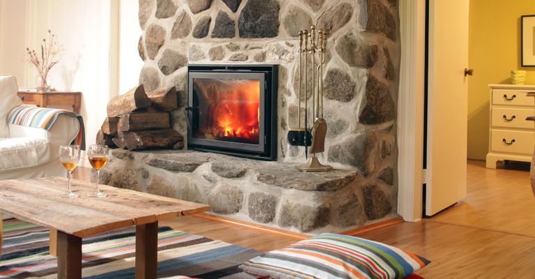 A cozy fireplace in a lodge