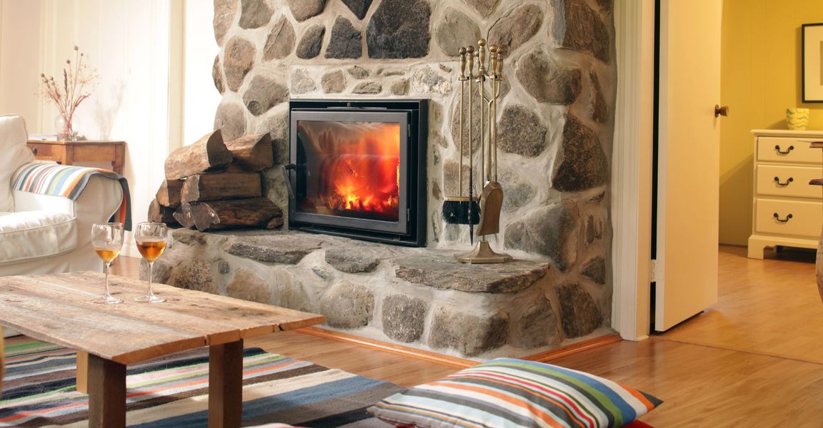 A cozy fireplace in a lodge