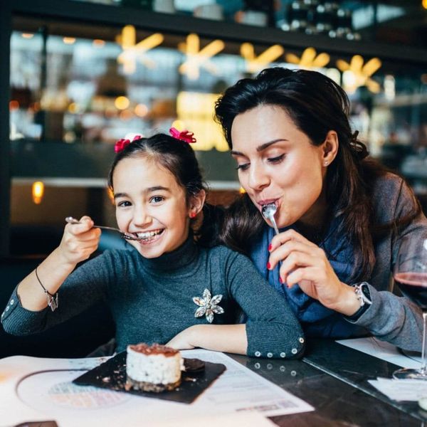 mom and daughter sharing dessert