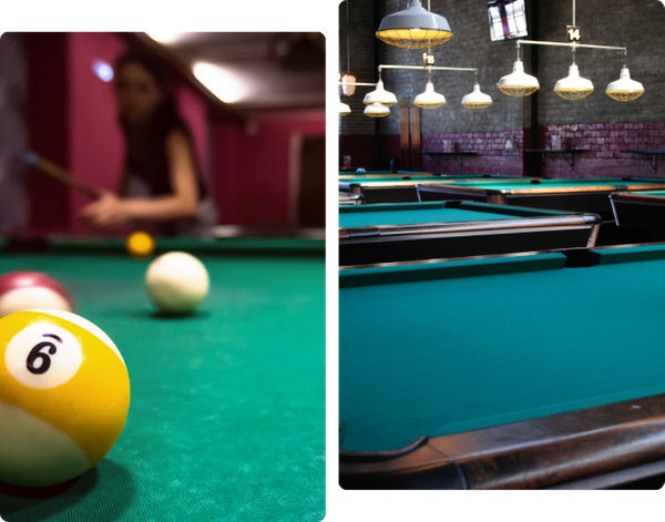 billiard tables and pool balls set up