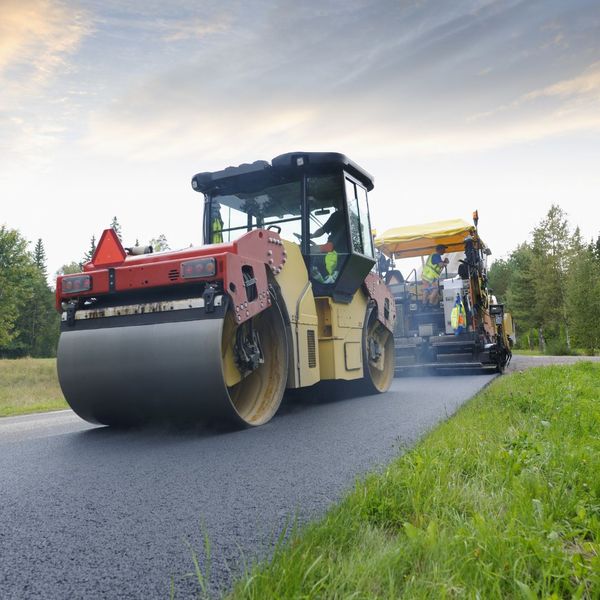 machinery on asphalt driveway