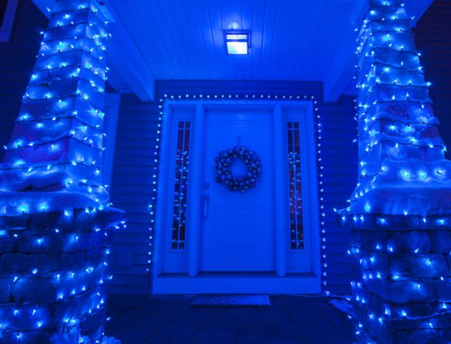 A house lit up with blue lighting