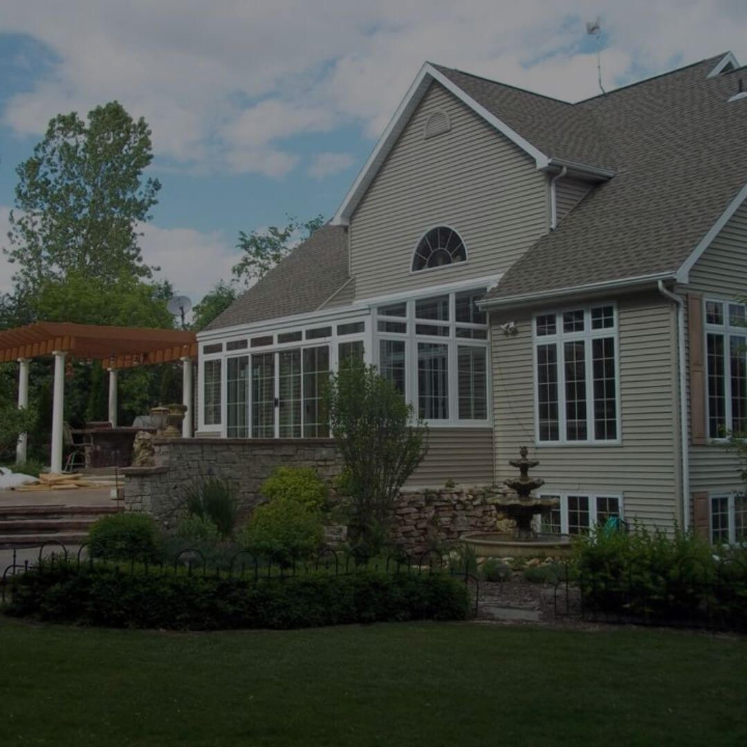 house with a straight-eave sunroom