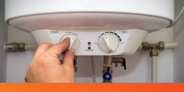 knob being adjusted on water heater