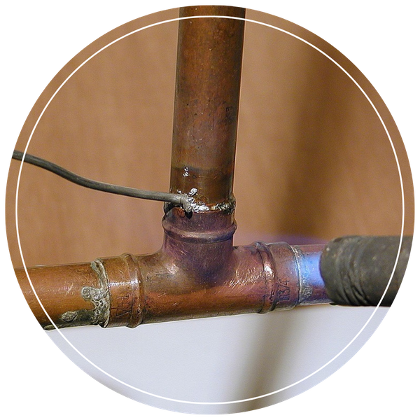 soldering a copper pipe fitting for a residential water line repair