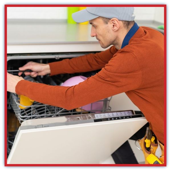 technician repairing dishwasher