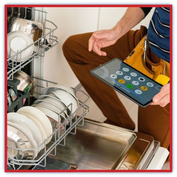 technician repairing dishwasher