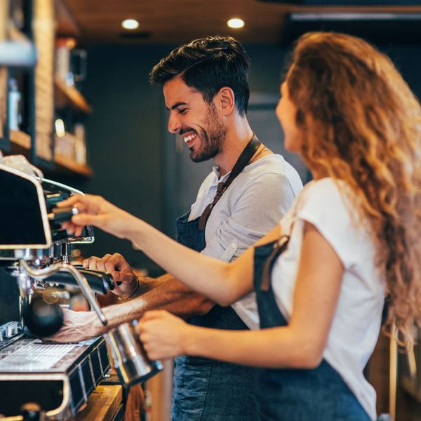 two baristas working