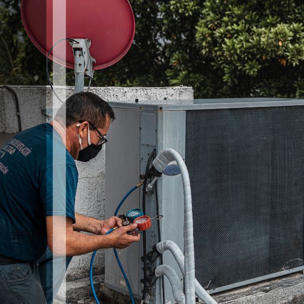HVAC technician testing unit