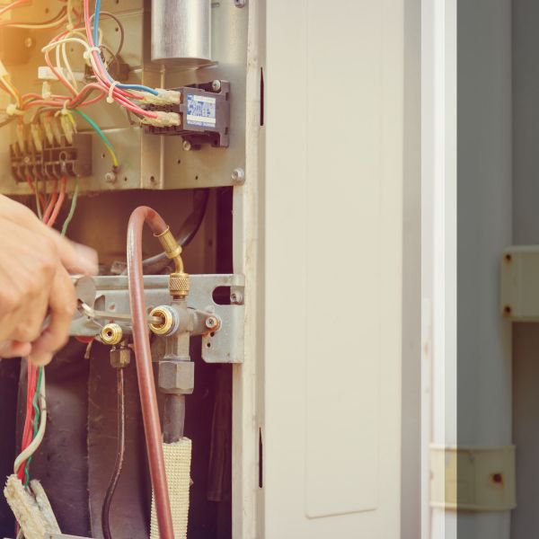 HVAC technician installing furnance