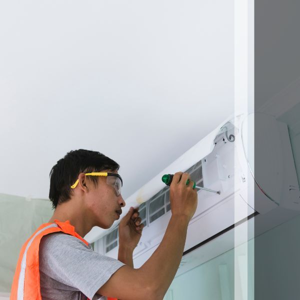 HVAC technician installing minisplit unit
