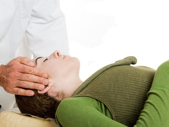 helping patient with neck pain