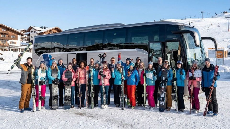 large group of friends beside charter bus at ski slopes