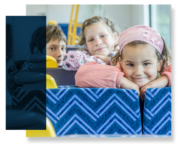 smiling kids on bus