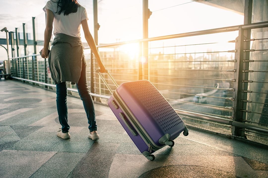 woman carrying luggage