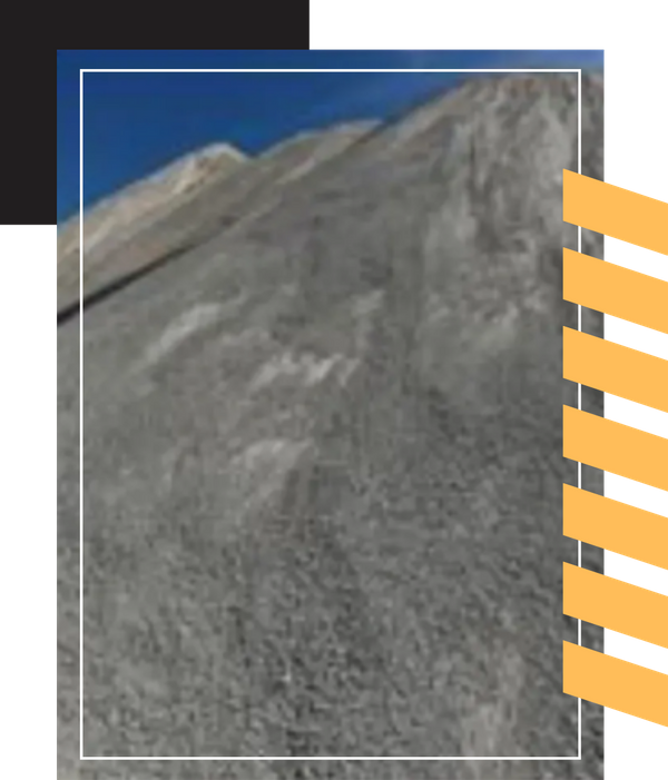 A close-up view of a large mound of gray crushed stone.