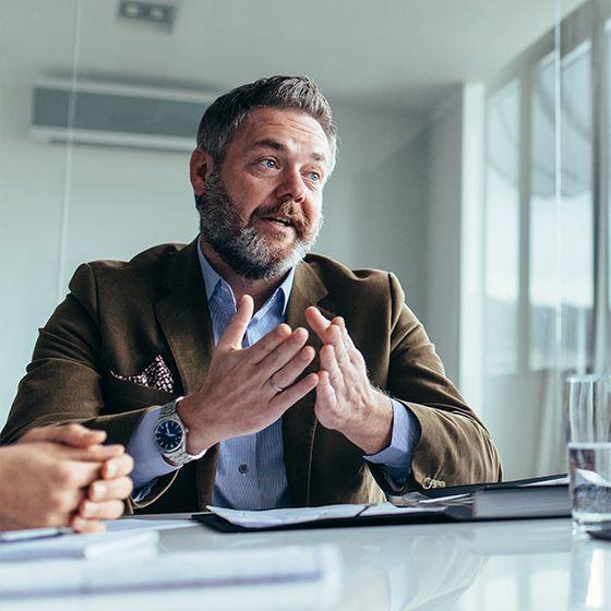 Business man leading meeting