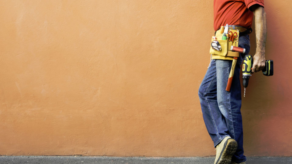 A homeowner outside their home.