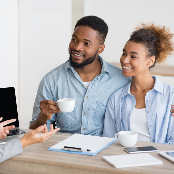 couple discussing buying a home with real estate agent