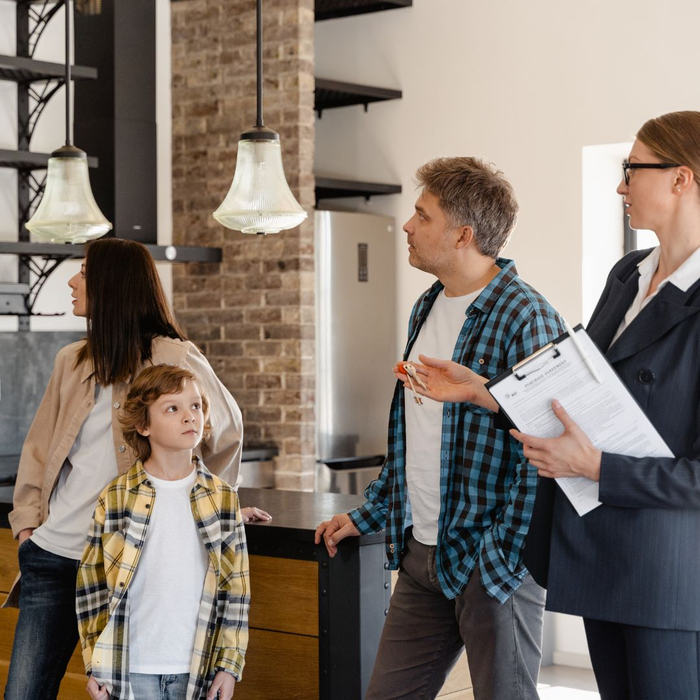 family looking at house with agent family looking at house with agent