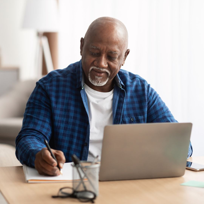 man researching on a computer