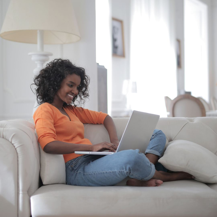 woman smiling at computer woman smiling at computer
