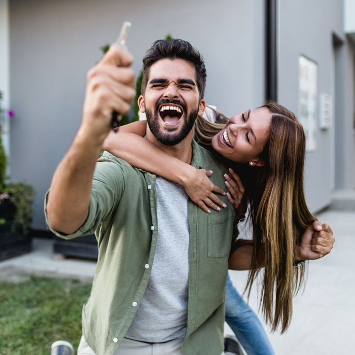 excited couple after they bought their first home