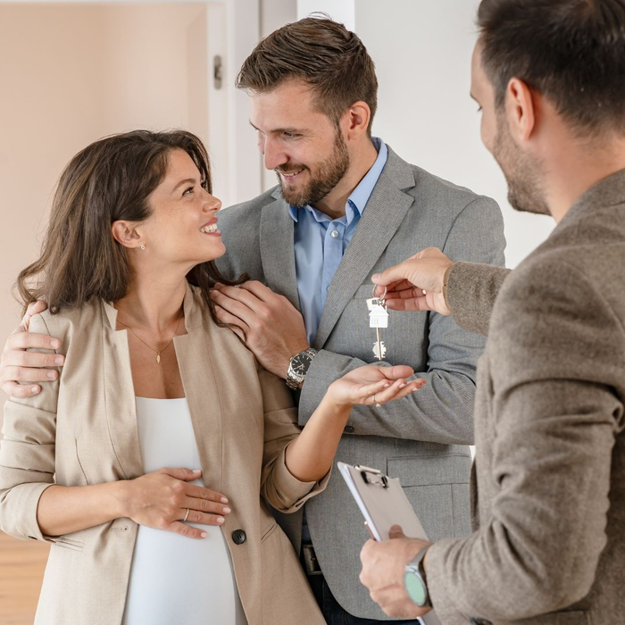 couple getting keys to the house 