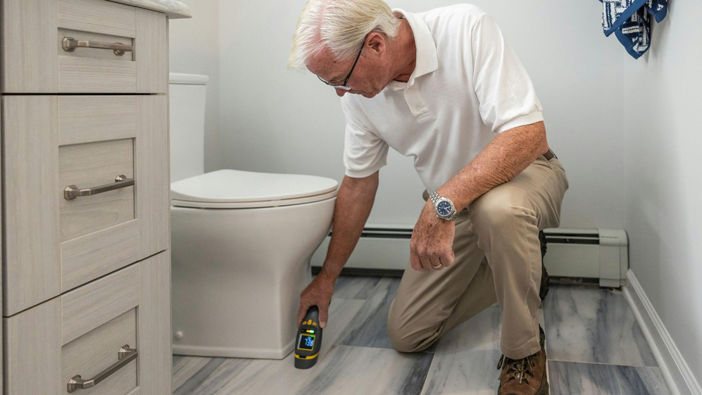 inspector in the bathroom of a home