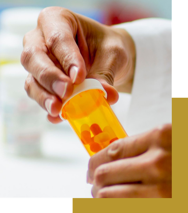 pharmacist opening pill bottle
