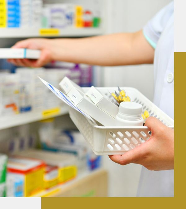 Pharmacist pulling prescriptions from a shelf