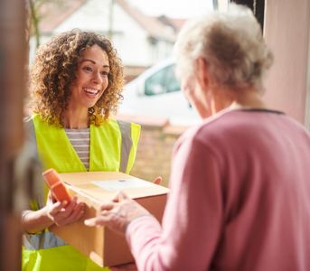 woman getting her prescriptions delivered