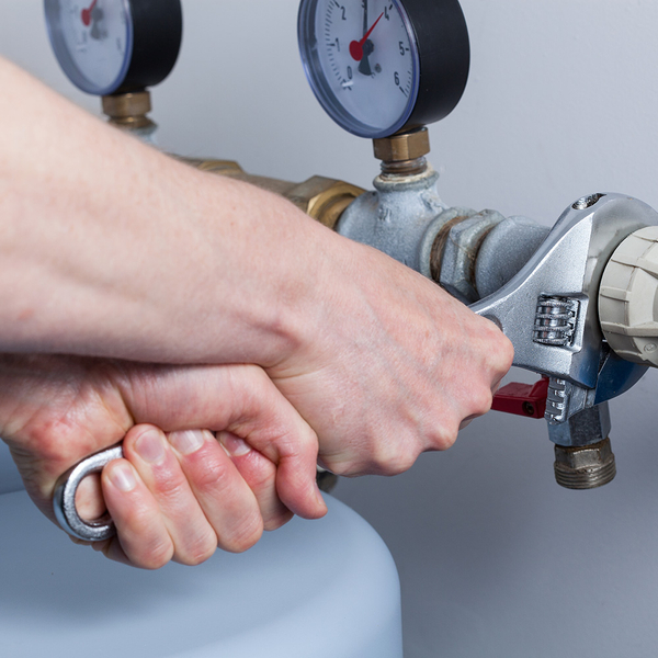 plumber fixing a pipe