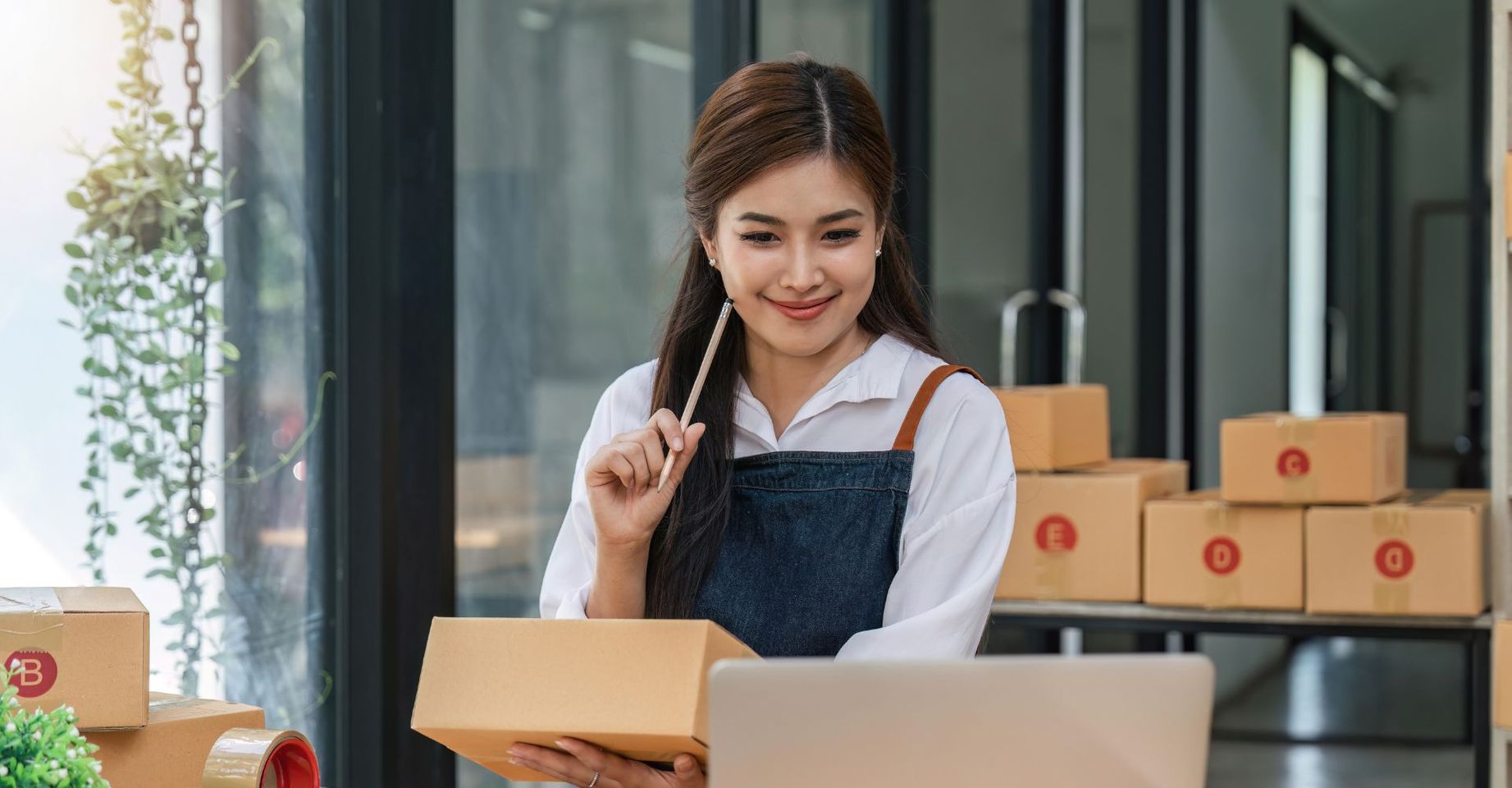 person packing ecommerce shipments