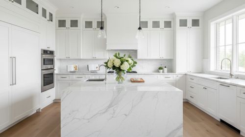 A beautifully remodeled modern kitchen with a large island, representing the ultimate guide to a kitchen remodel.