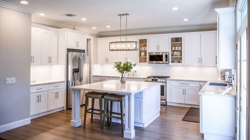 remodeled kitchen with white cabinetry