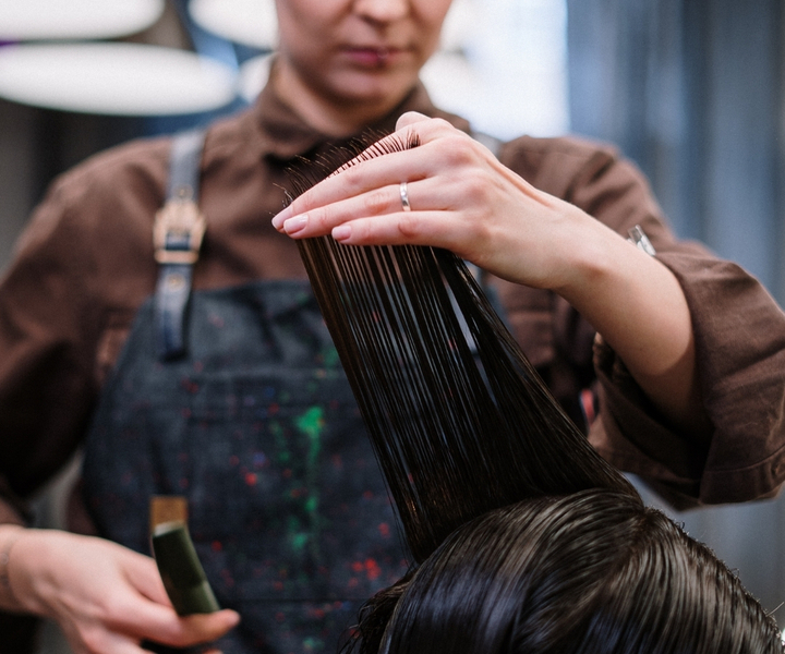 person getting a haircut person getting a haircut