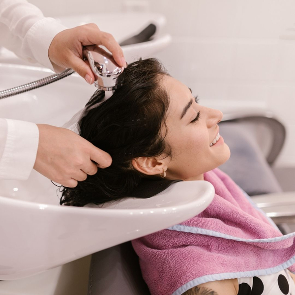 Woman getting hair washed